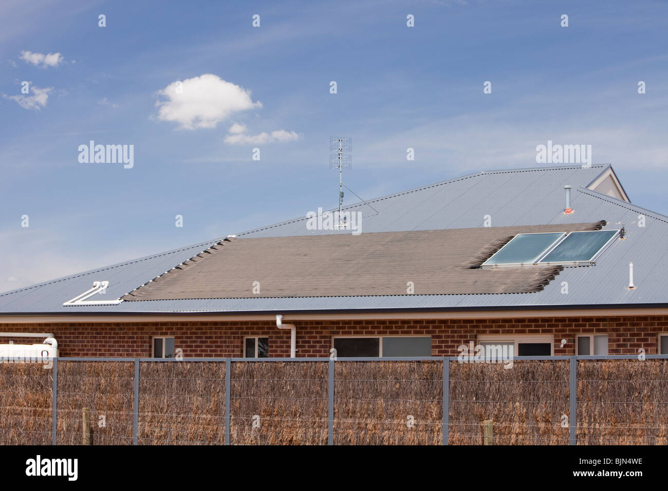 Solar water heaters on a house roof near Echuca, Victoria, Australia. Stock Photo