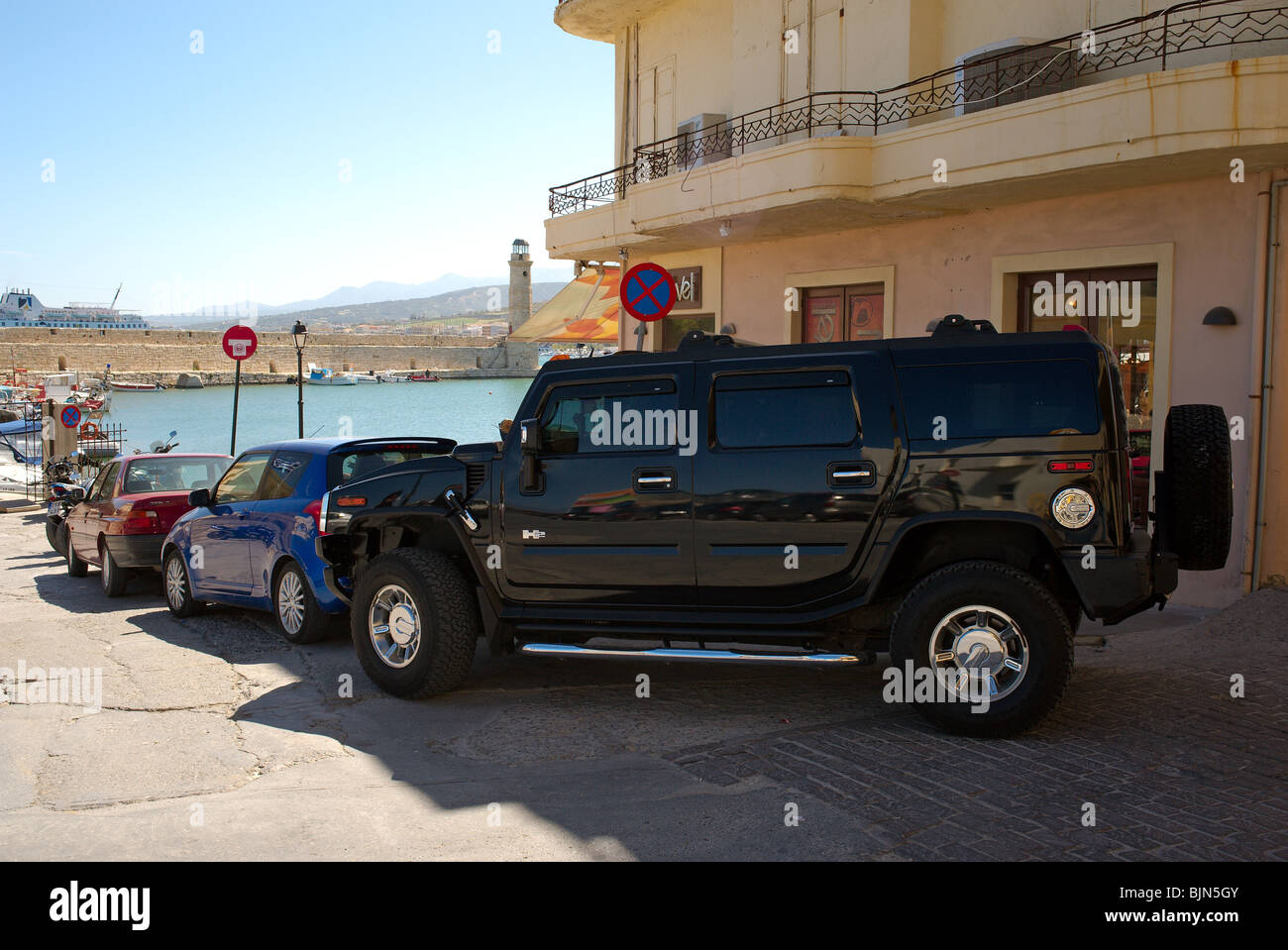 Hummer parked by the harbour in Rethymnon old town Crete Greece Stock Photo