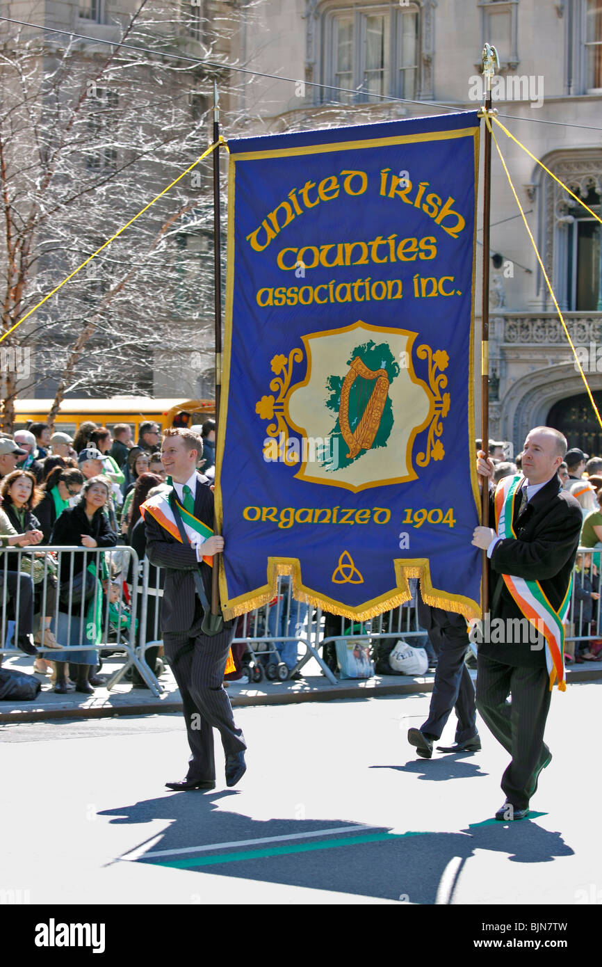 Marchers carrying banner in St. Patrick's Day parade on 5th Avenue in