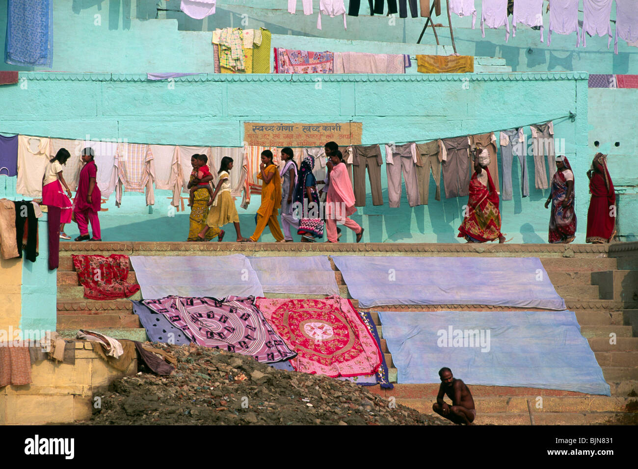 India, Varanasi, Ganges river, laundry, people drying clothes on Ganges river steps Stock Photo