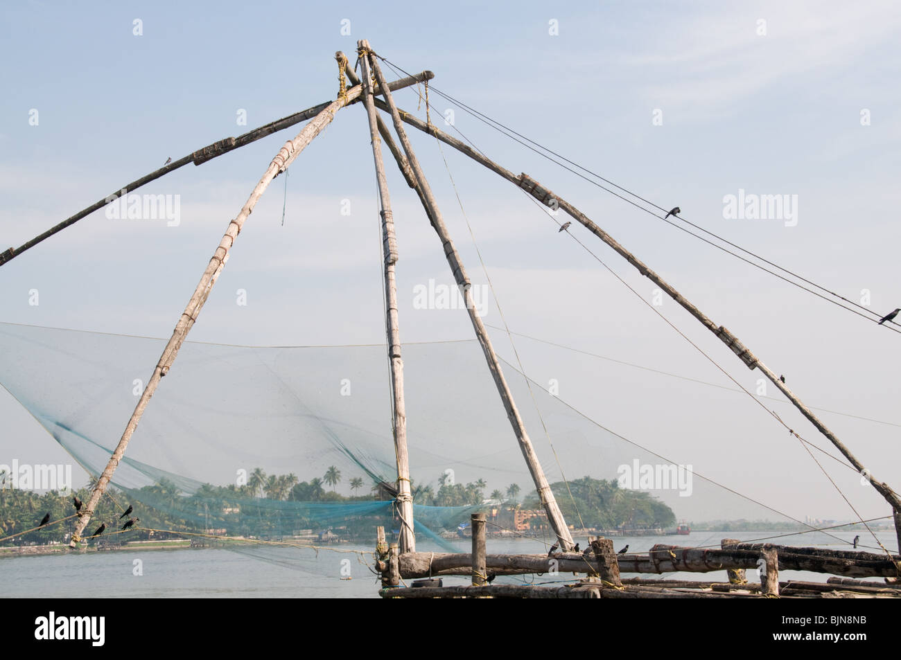 A chinese fishing net on the beach at Fort Kochi, Kochi, Kerala, India Stock Photo
