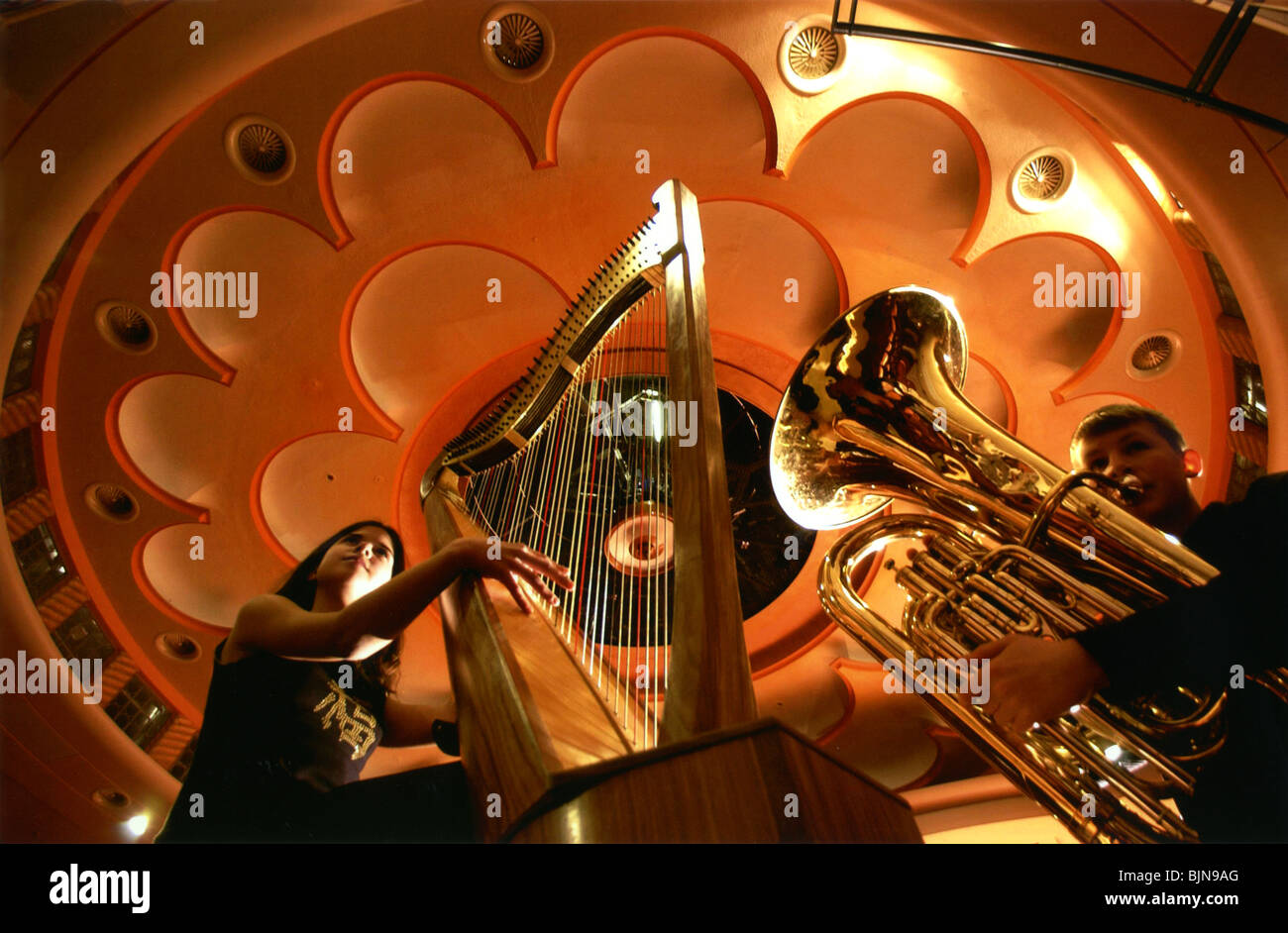Child musicians rehearse for a concert at The Dome in Brighton under the spectacular acoustic Art Deco ceiling. Stock Photo