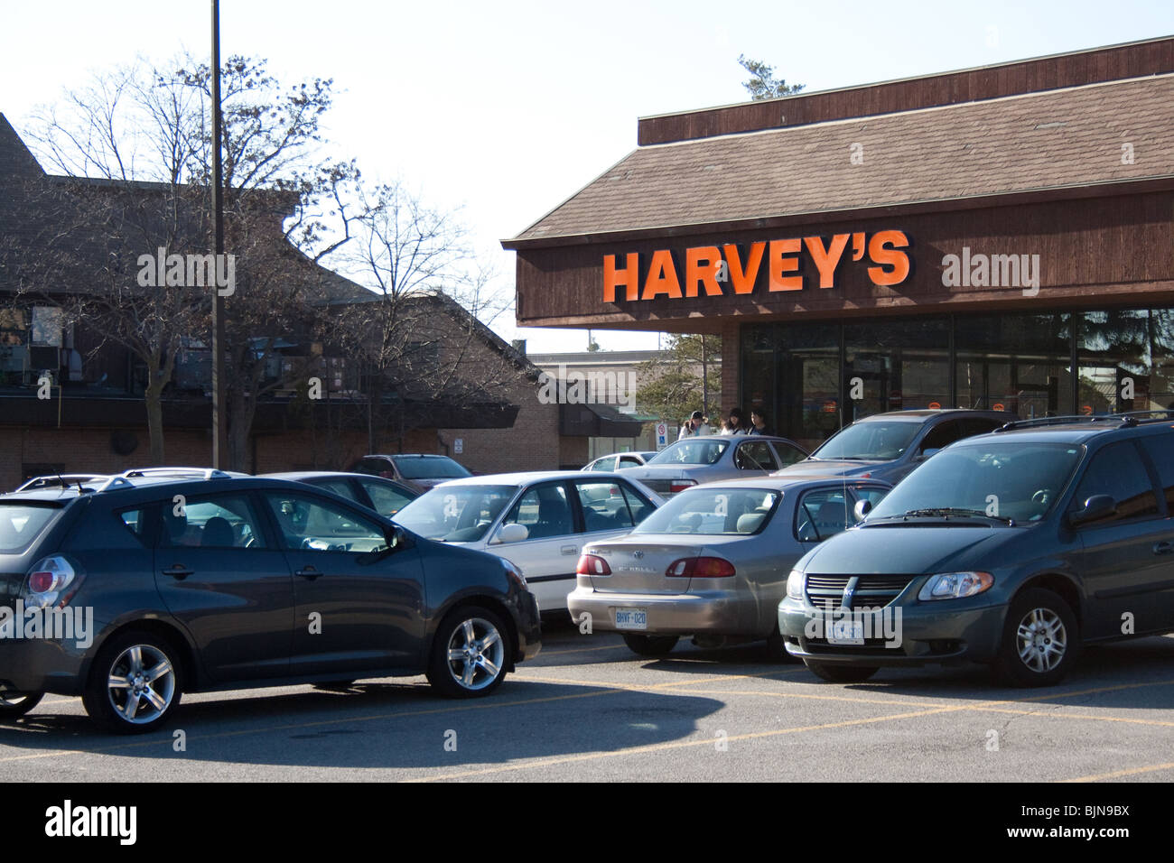 harvey harvey's harveys fast food burger restaurant unhealthy fries coke oily fat mcdonald burger king cheap inexpensive family Stock Photo