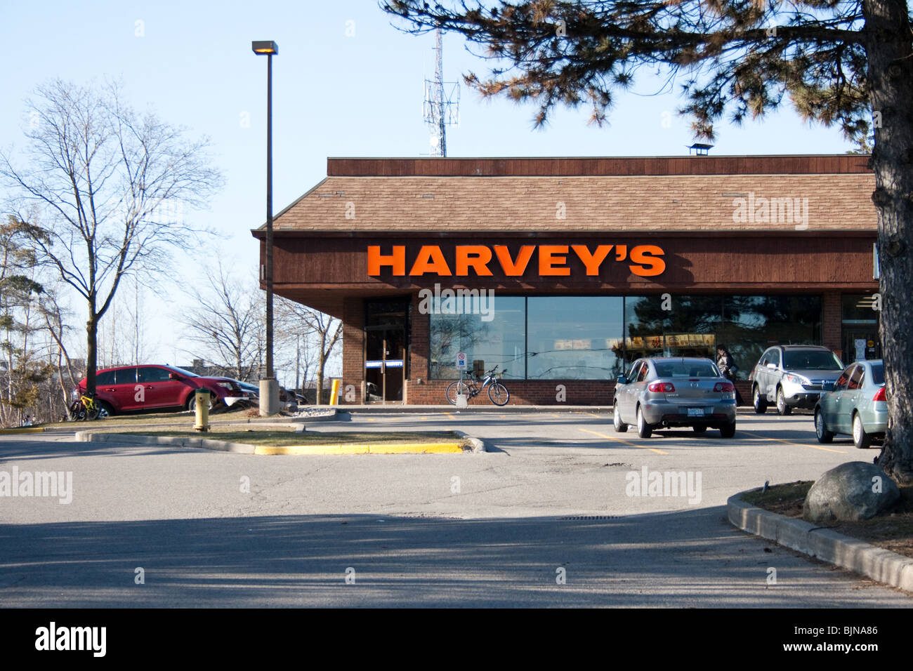 harvey harvey's harveys fast food burger restaurant unhealthy fries coke oily fat mcdonald burger king cheap inexpensive family Stock Photo