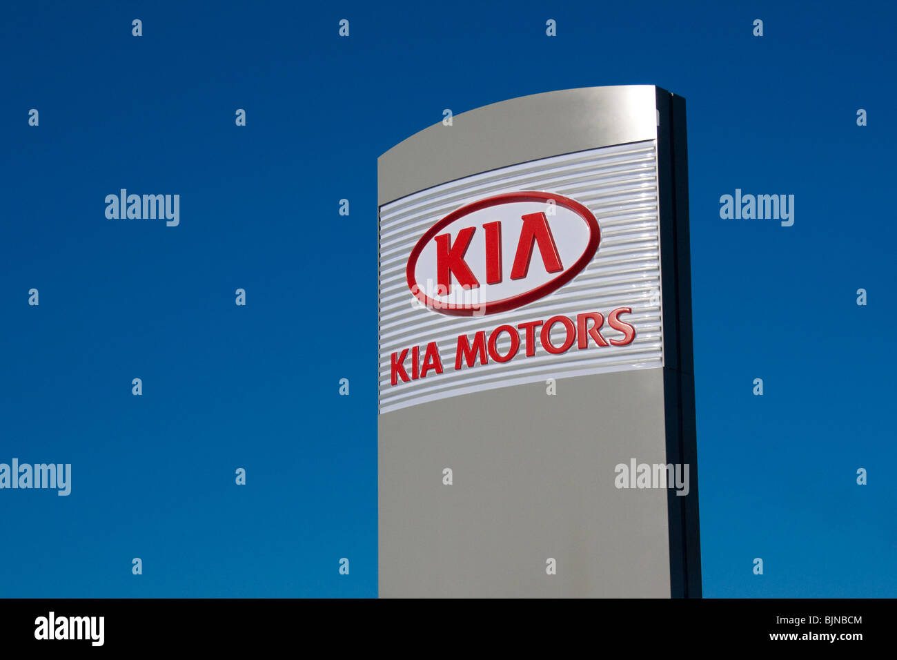 Kia motors motor logo company dealership blue sky Stock Photo