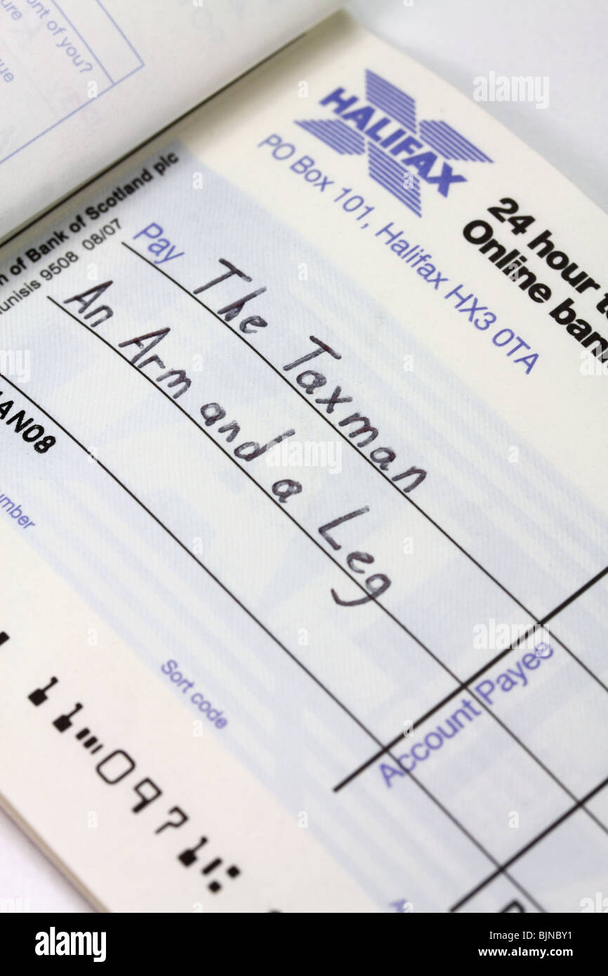 Writing a cheque to the Taxman Stock Photo