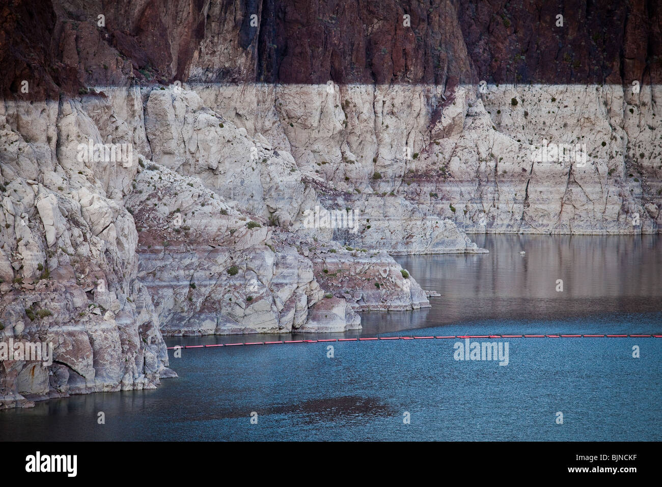 Marks along the canyon walls of Lake Mead at the Hoover Dam show the low water level due to over use of water resources Stock Photo