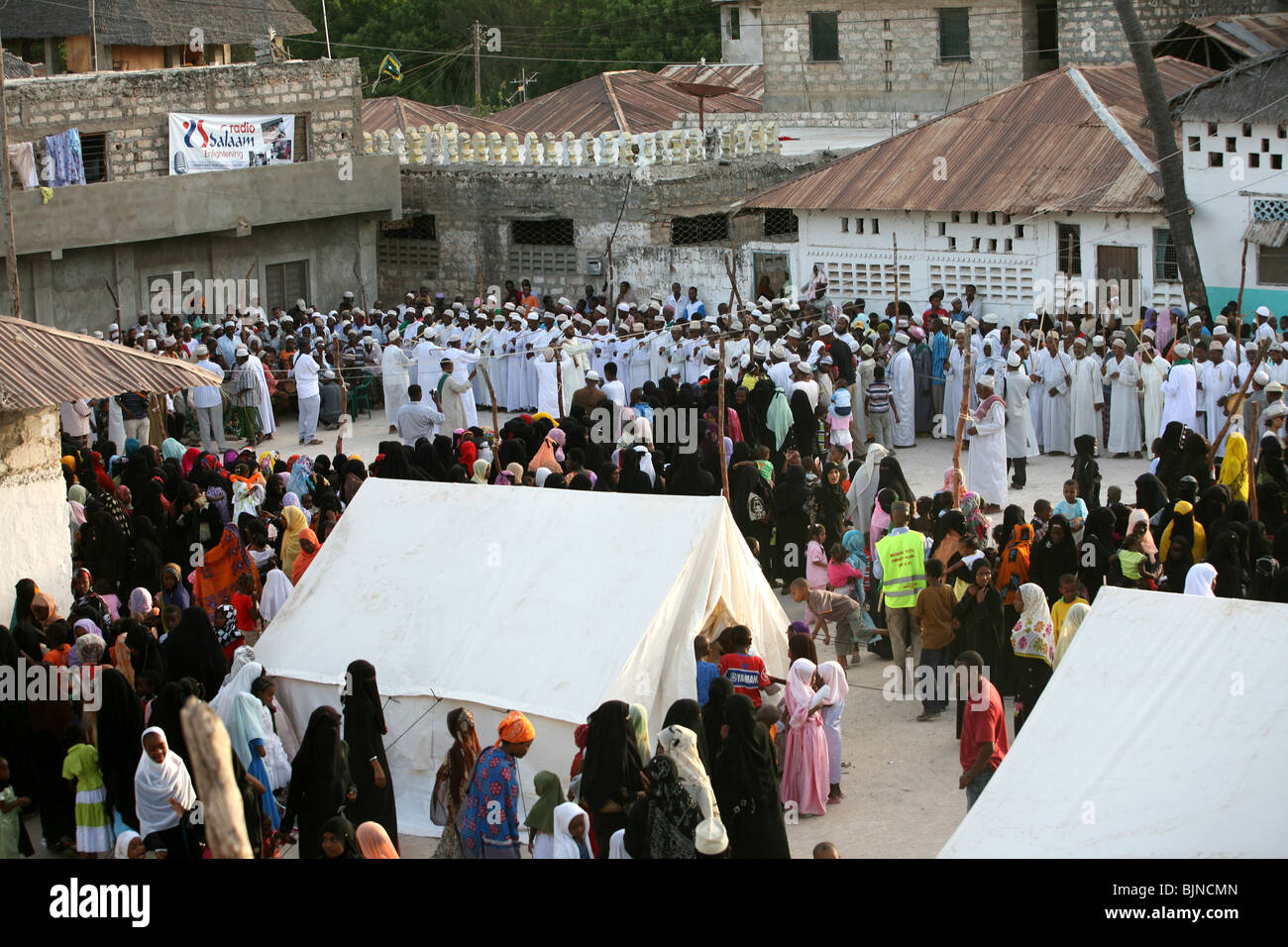 Crowds celebrating Maulidi outside Riyadha Mosque Lamu Kenya Stock Photo