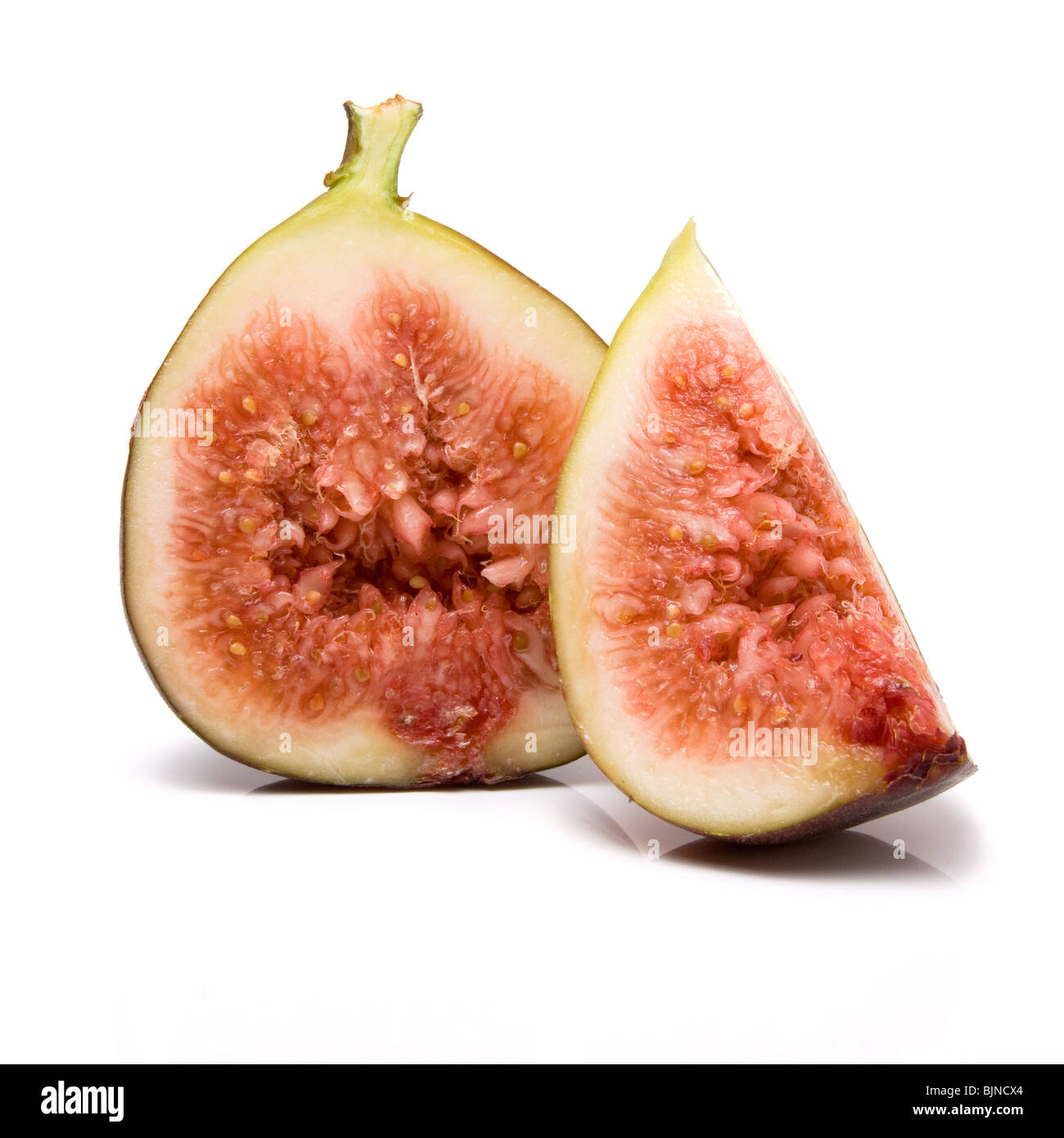 Over Ripped Figs Sliced ripe figs from low viewpoint isolated against white background ...