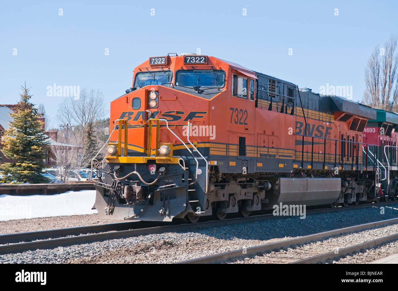 BNSF (Burlington Northern Santa Fe) diesel railway engine pulling a train through Flagstaff, Arizona. Stock Photo