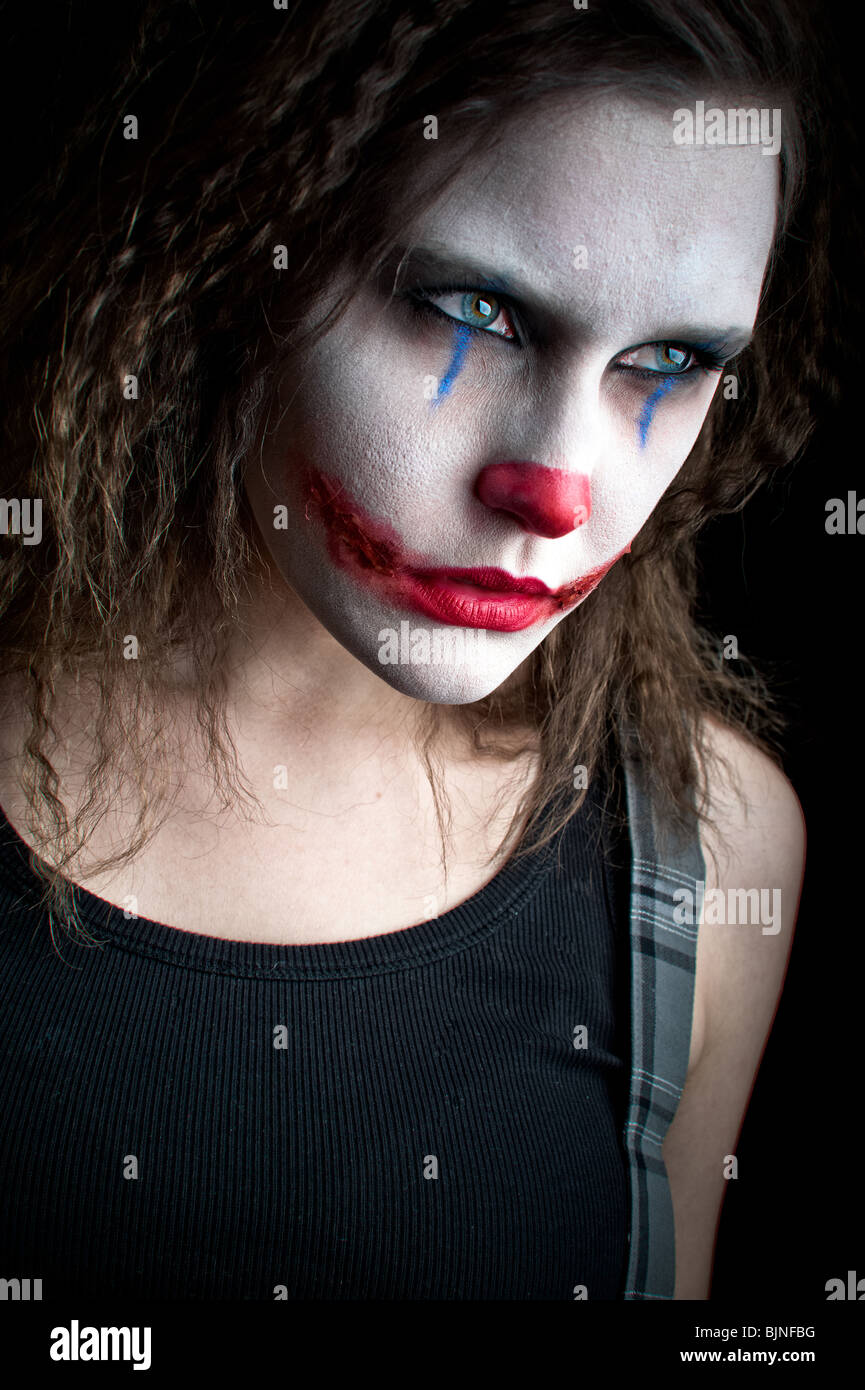 a scary and evil looking female clown Stock Photo