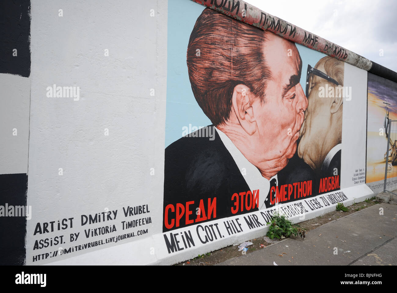 Eastside Gallery, Mortal Kiss or Kiss of Death, painting on the remaining part of the Berlin Wall, Berlin, Germany, Europe. Stock Photo