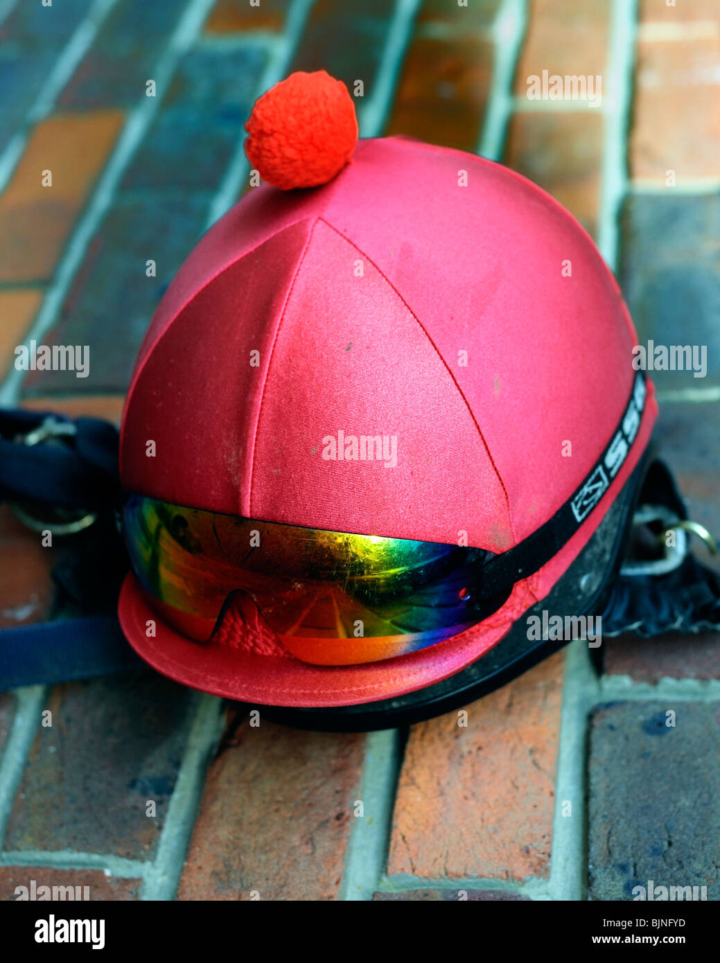 Jockey helmet and goggles Stock Photo - Alamy
