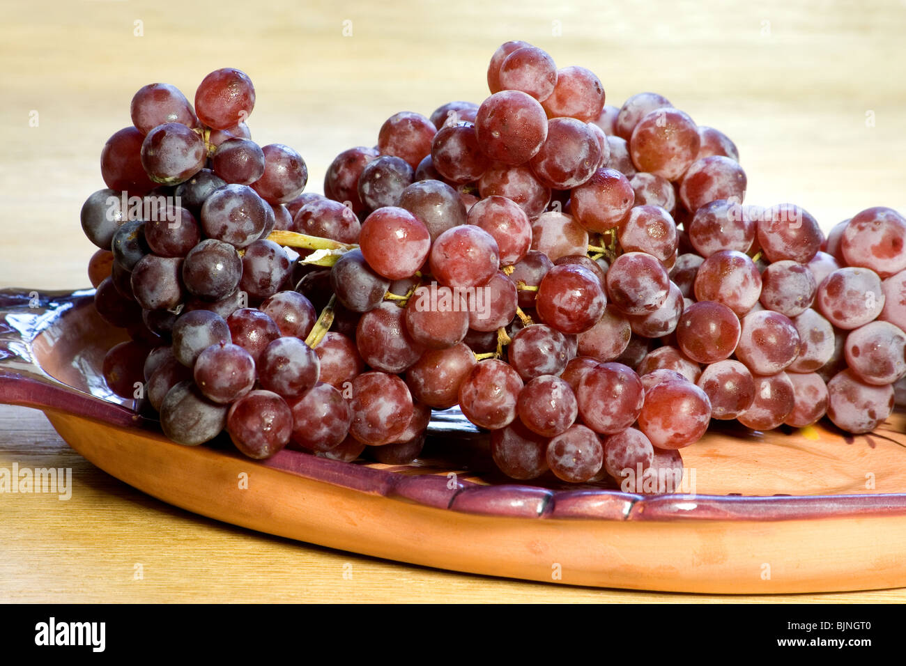Red grapes in a dish Stock Photo