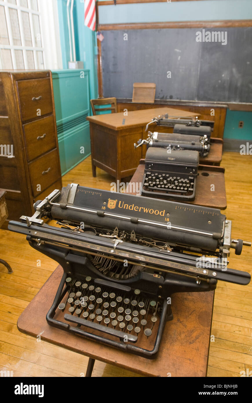 Old manual typewriters are seen in an unused classroom in a school in