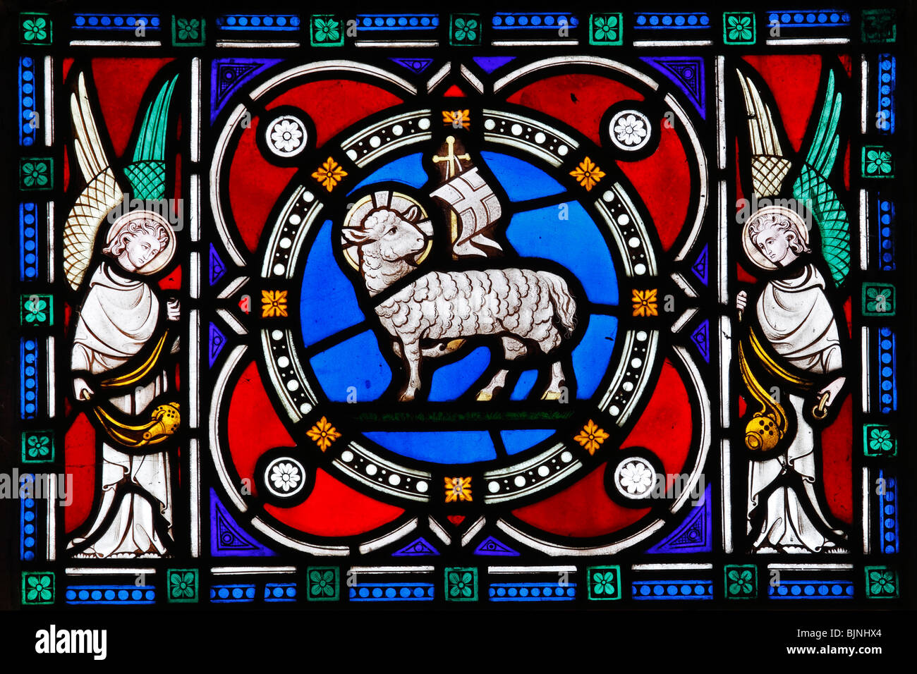 Detail from a stained glass window by Clayton and Bell, depicting the Lamb of God, St Margaret's Church, Witton, Norfolk Stock Photo