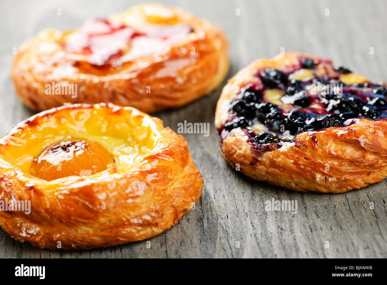 Closeup on three sweet fruit danish desserts Stock Photo