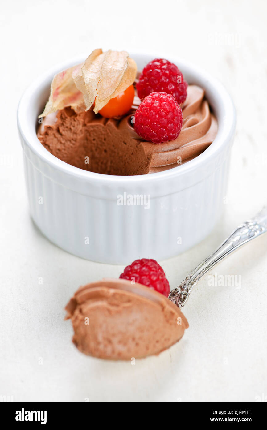 Closeup of chocolate mousse dessert with a spoon Stock Photo