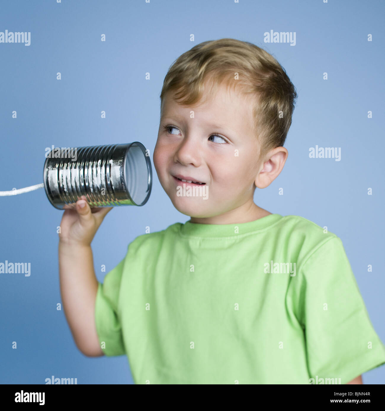 Boy with tin can Stock Photo Alamy