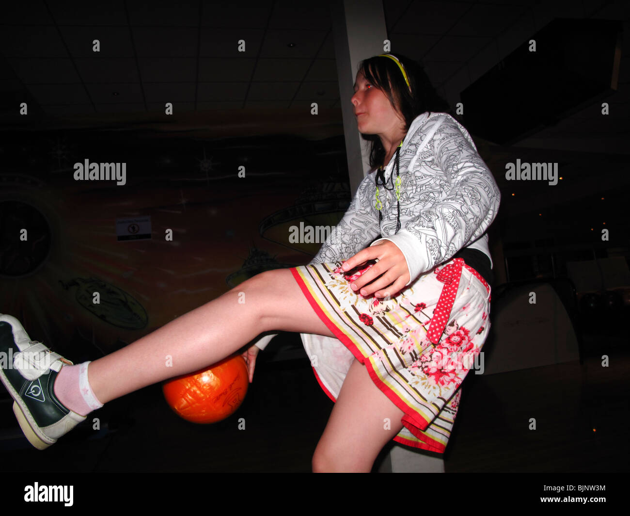 Young girl ten pin bowling Stock Photo