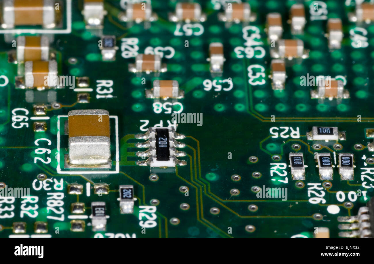 close up photograph of electronic components on a computer mother board Stock Photo