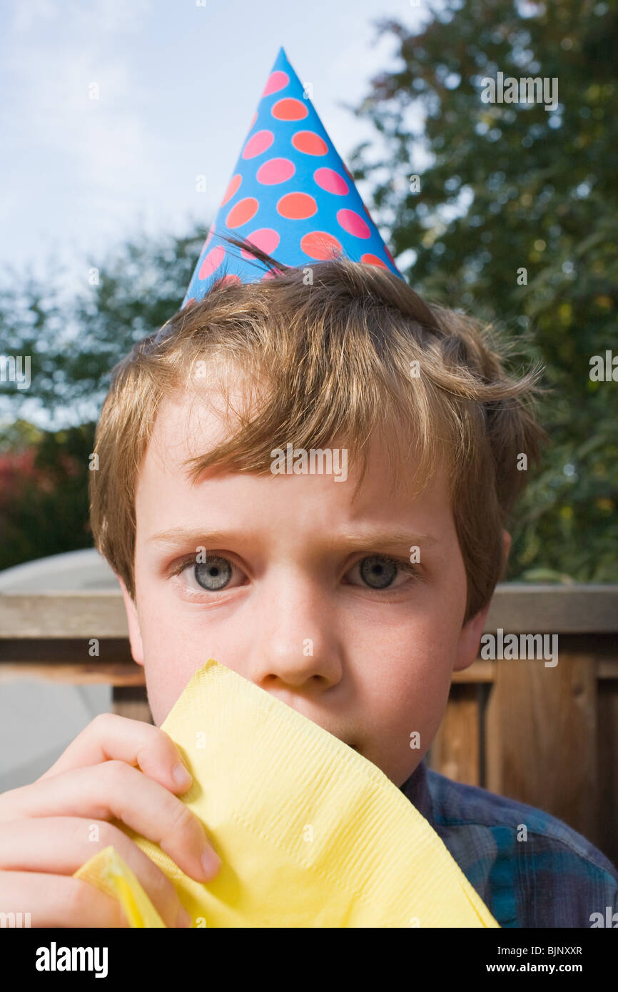 Boy in a party hat Stock Photo Alamy