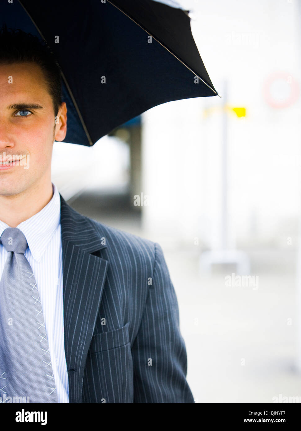 Closeup of man with umbrella Stock Photo