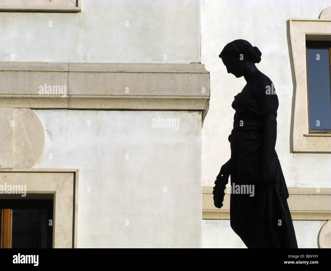 statue of woman in town in italy Stock Photo - Alamy