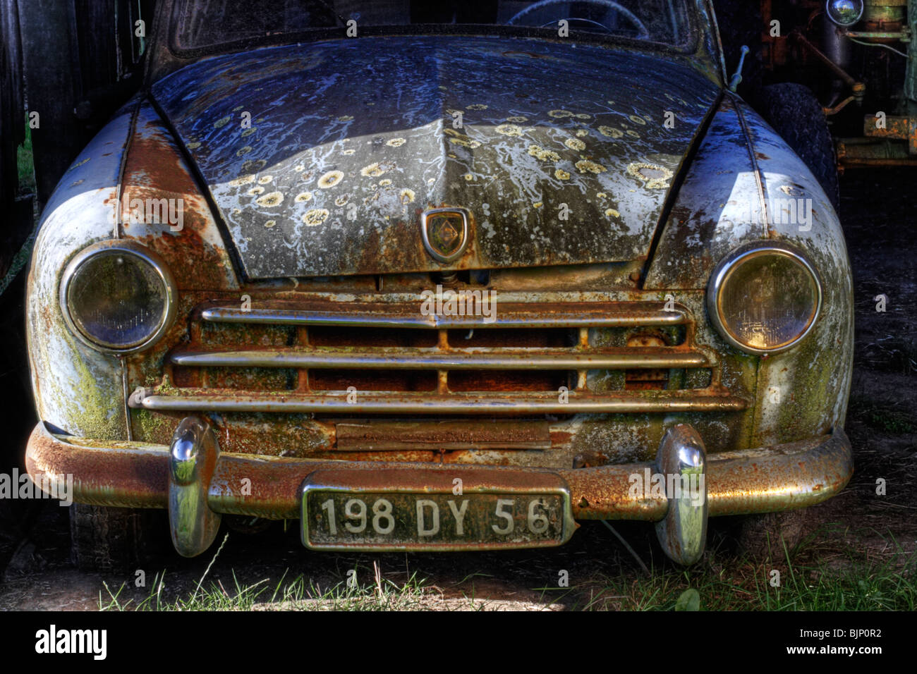 Rusty old broken down french car. Stock Photo