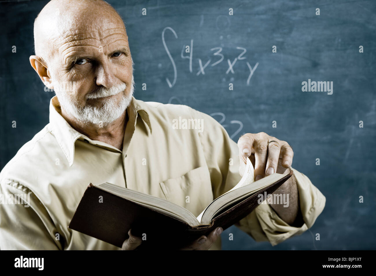 Male school teacher with book Stock Photo