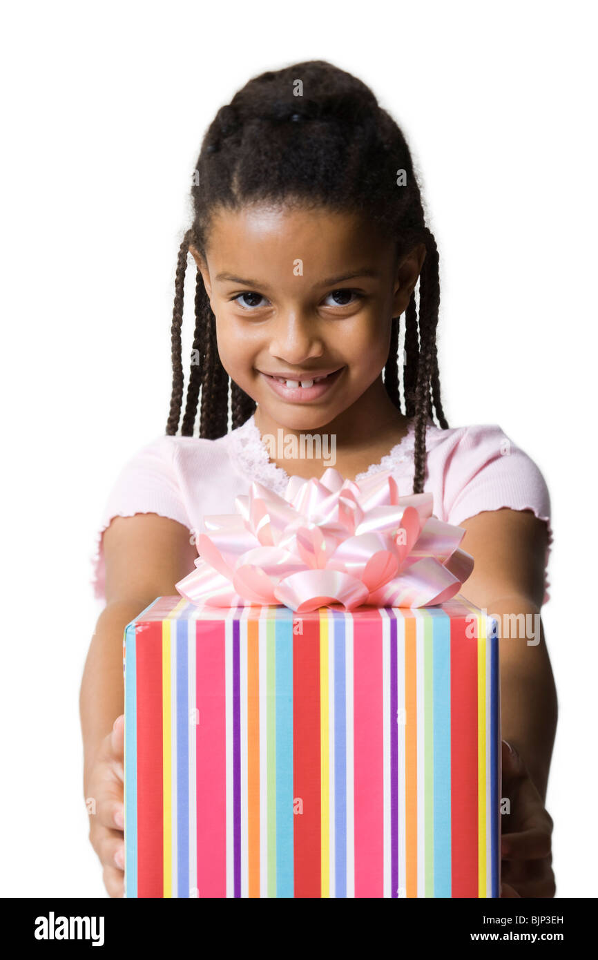 Girl holding birthday present Stock Photo - Alamy