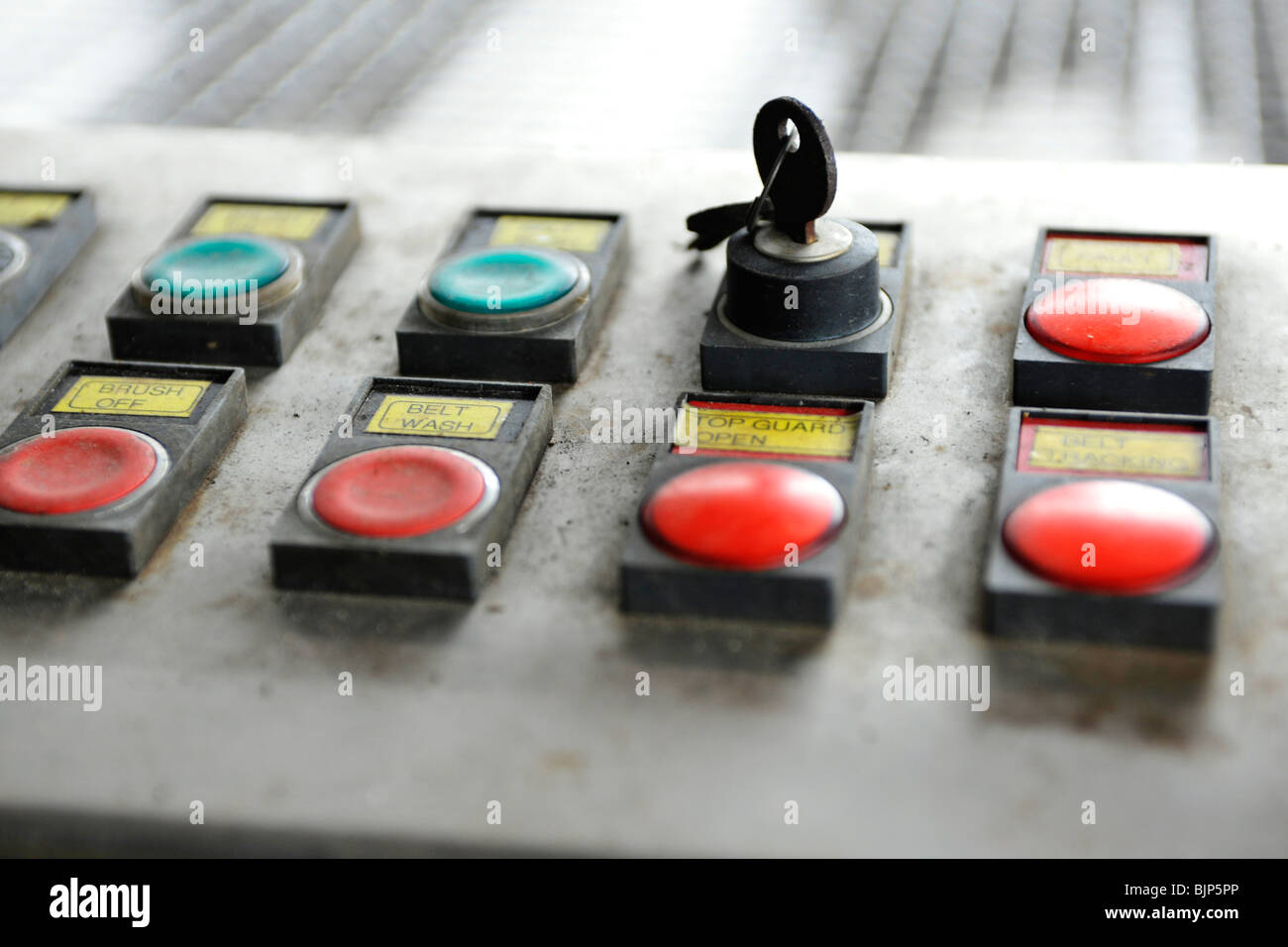 on button on machine with key Stock Photo