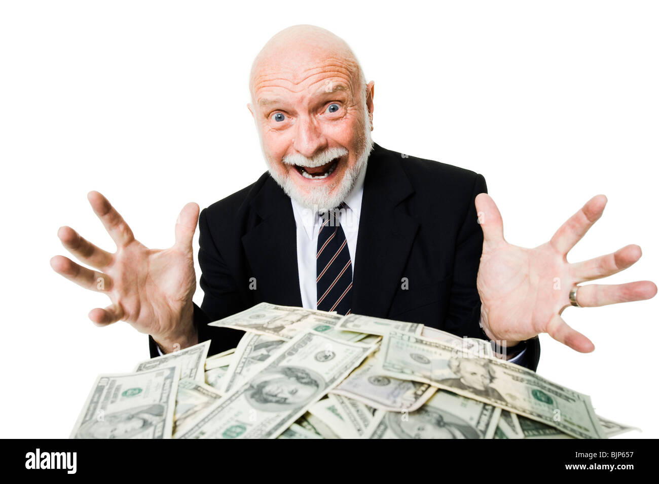 Closeup of businessman looking at pile of money Stock Photo