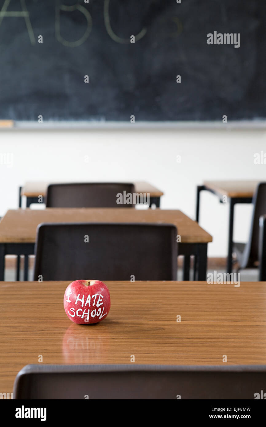 Apple on a desk Stock Photo Alamy