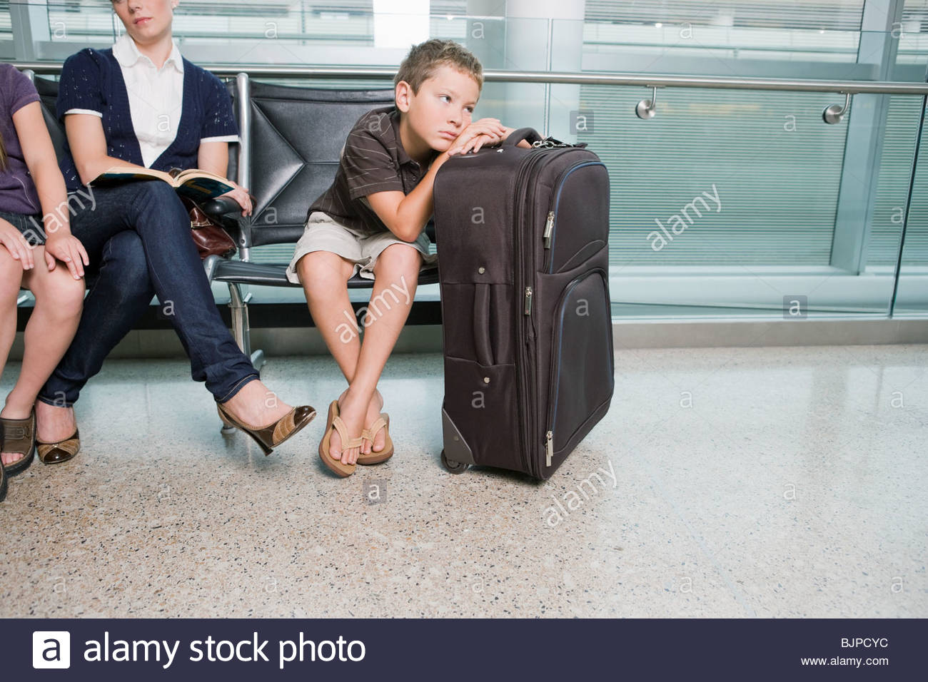 Young Woman Sitting On Suitcase Stock Photos & Young Woman Sitting On