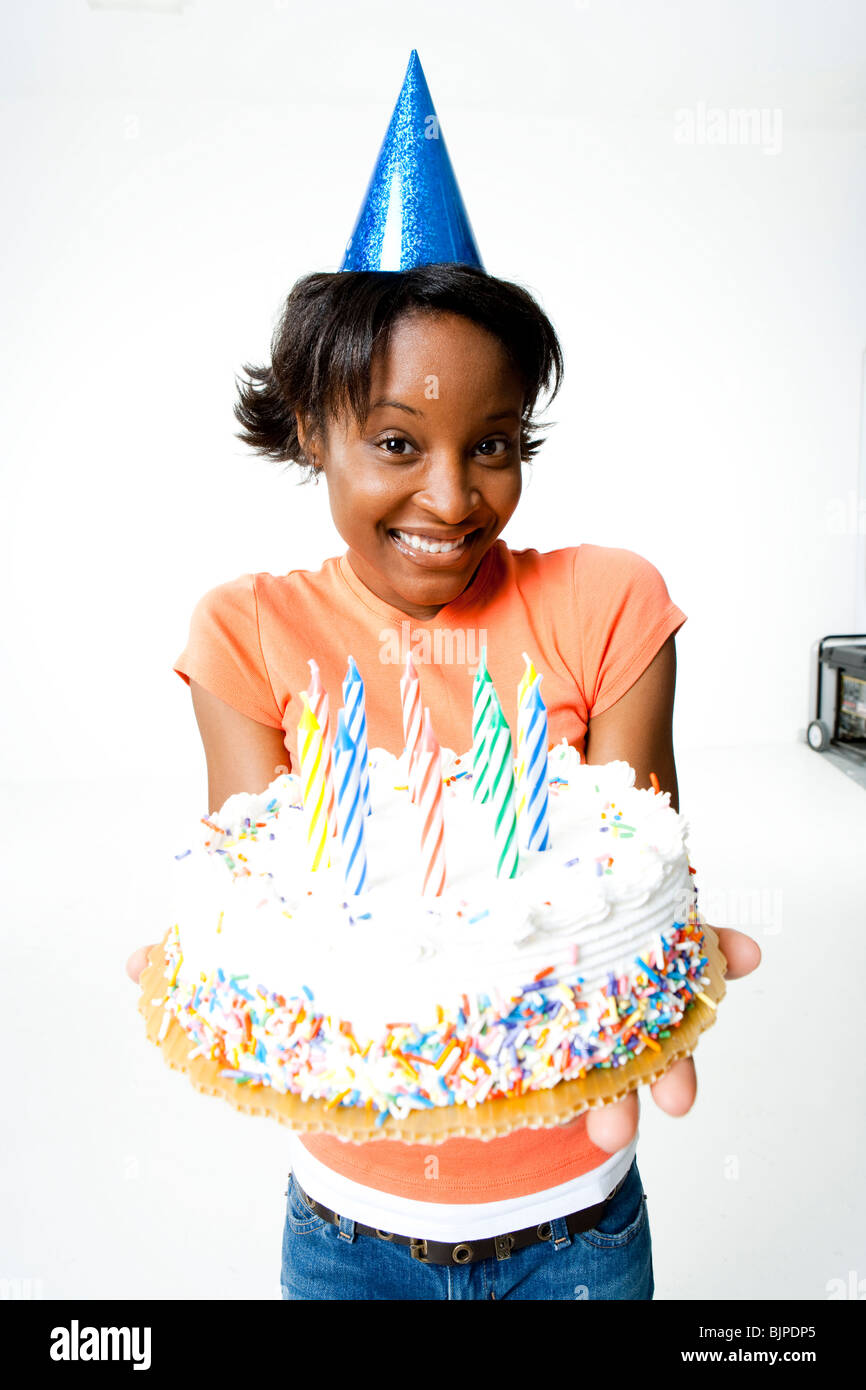 Woman holding a birthday cake Stock Photo