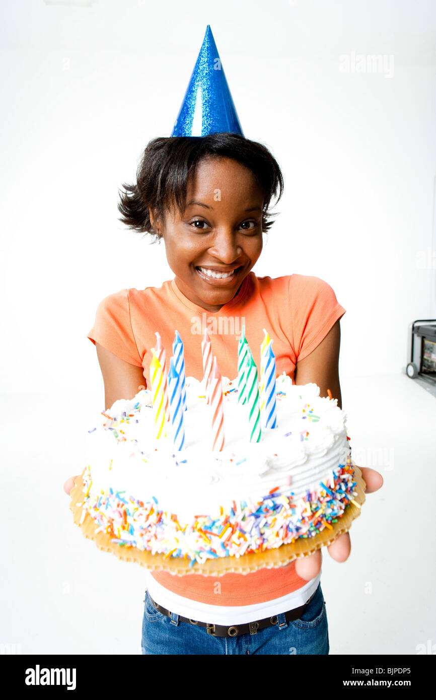 Woman holding a birthday cake Stock Photo - Alamy