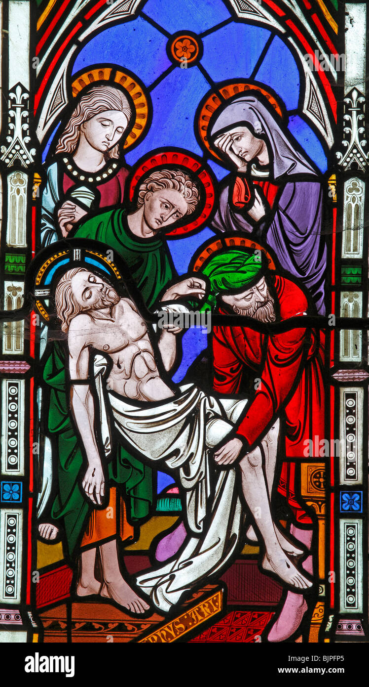 Detail from a stained glass window by Clayton and Bell, depicting The Deposition of Jesus, St Margaret's Church, Witton, Norfolk Stock Photo