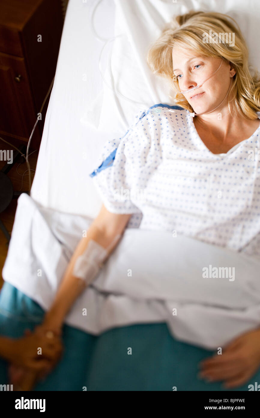 Woman sleeping in hospital bed Stock Photo Alamy