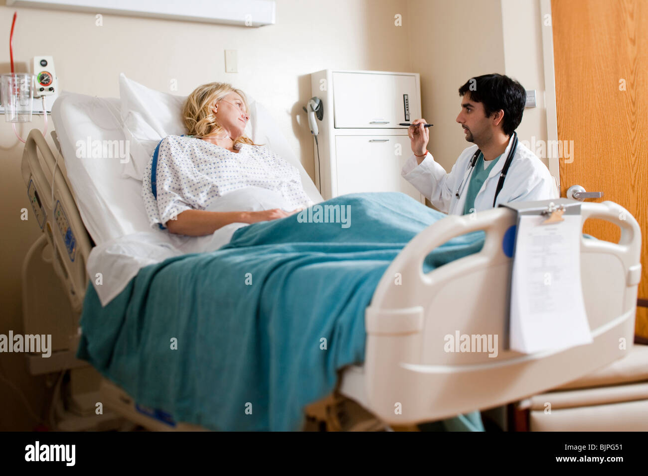 Woman in hospital bed Stock Photo