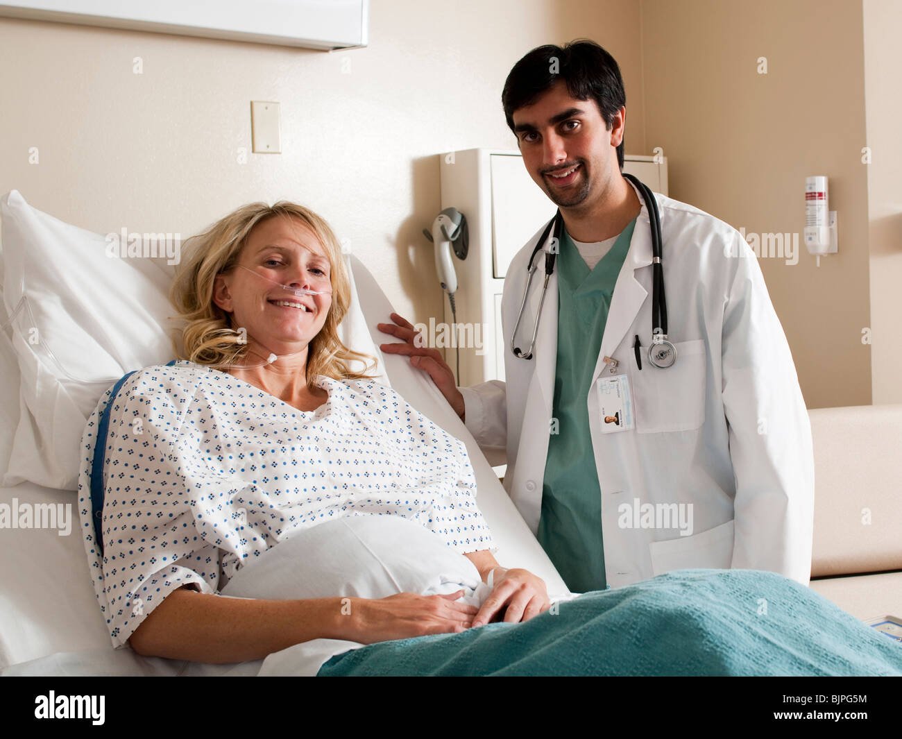 Woman in hospital bed Stock Photo