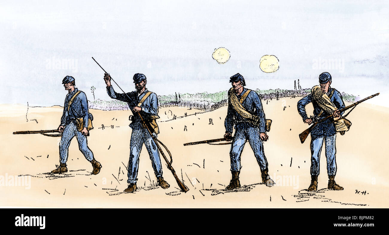 Union infantry scouts 'feeling the enemy' ahead of the main force. Hand-colored woodcut of a Winslow Homer illustration Stock Photo