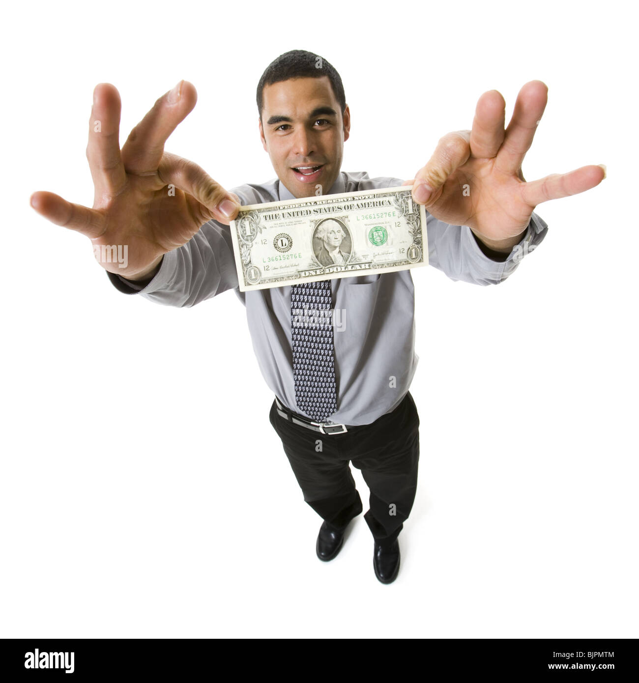 Businessman holding a one dollar bill Stock Photo