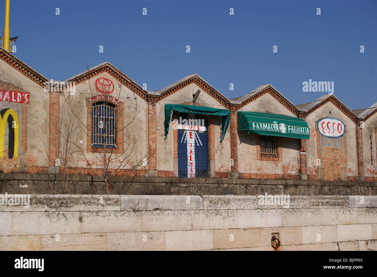 Venice -McDonalds graffiti on old wharf buildings Stock Photo