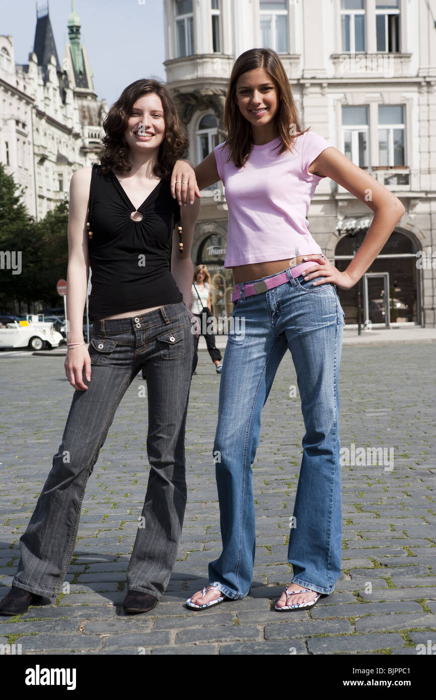 Two women standing in the street Stock Photo - Alamy