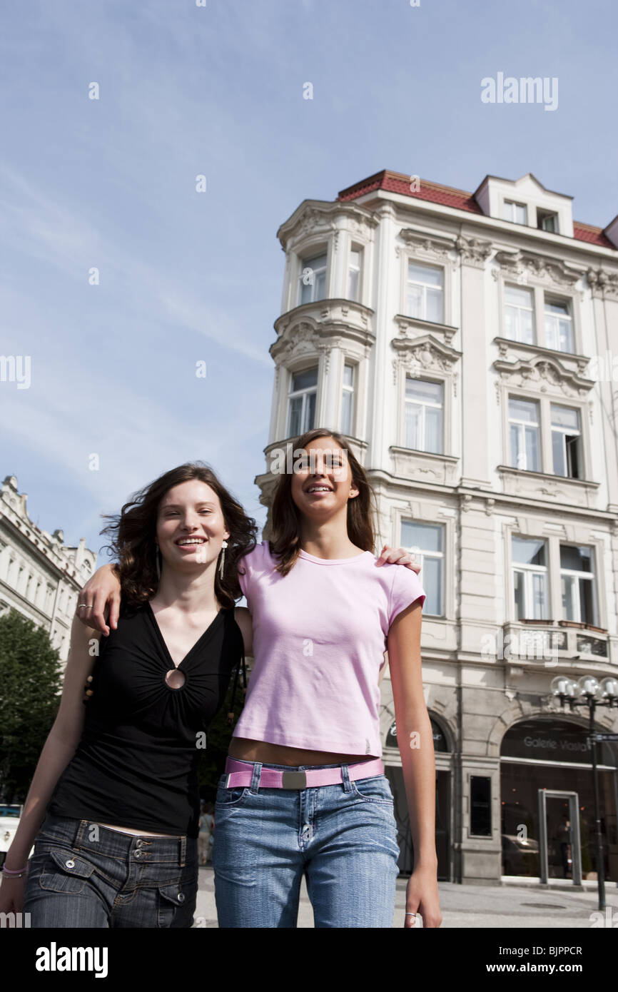 Two women standing in the street Stock Photo - Alamy
