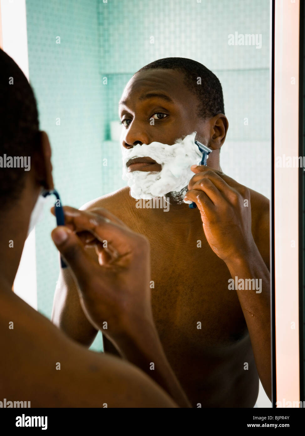 Male putting shaving cream on face Stock Photo Alamy