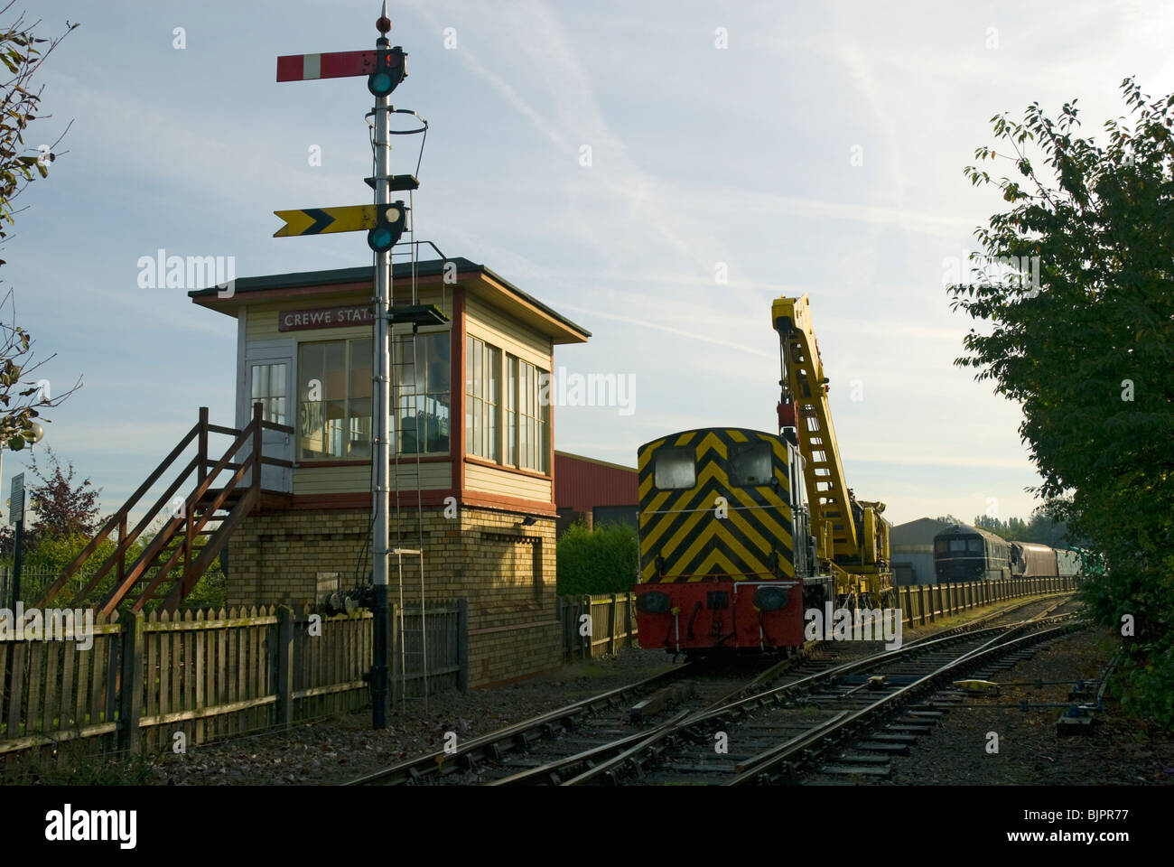 Shunting loco, signal box, signal and Cowans Sheldon 50 tonne strut jib rail crane at Crewe, Cheshire, UK Stock Photo