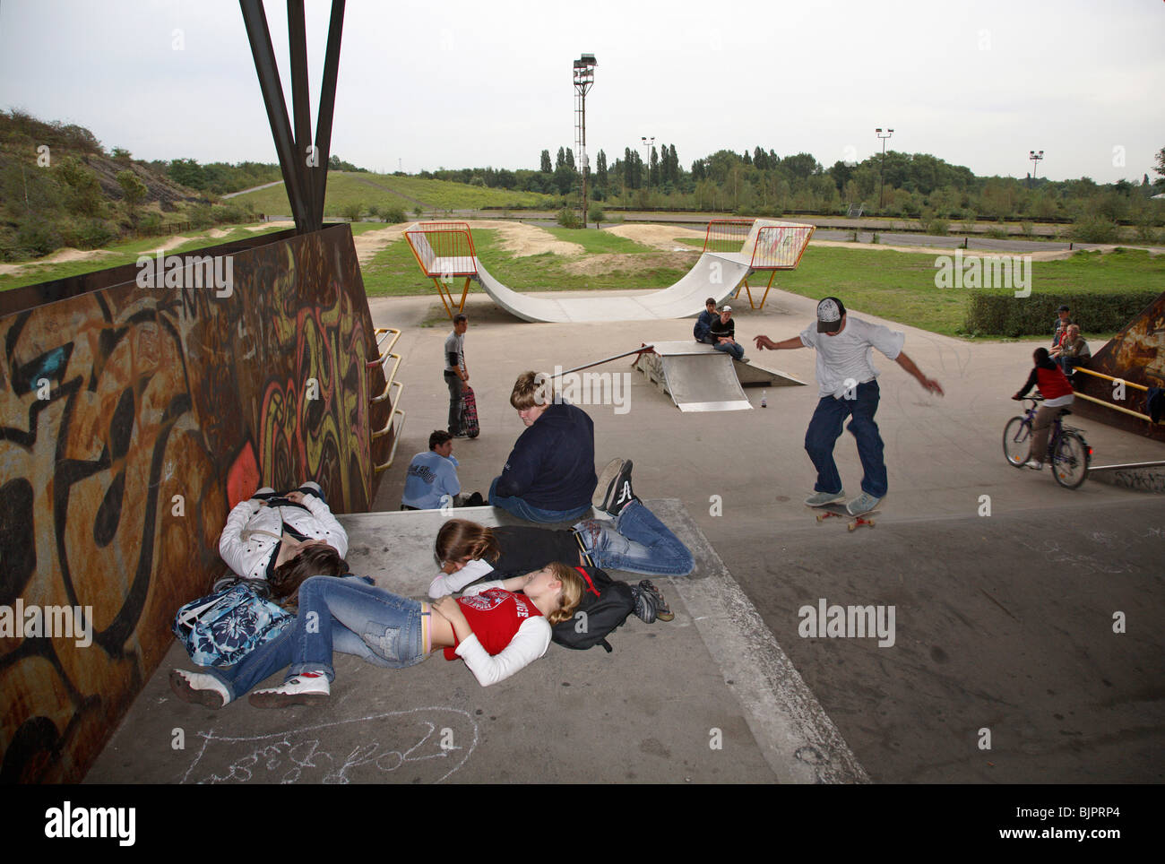 Teenagers in the skatepark in Emscher Park, Duisburg, Germany Stock Photo