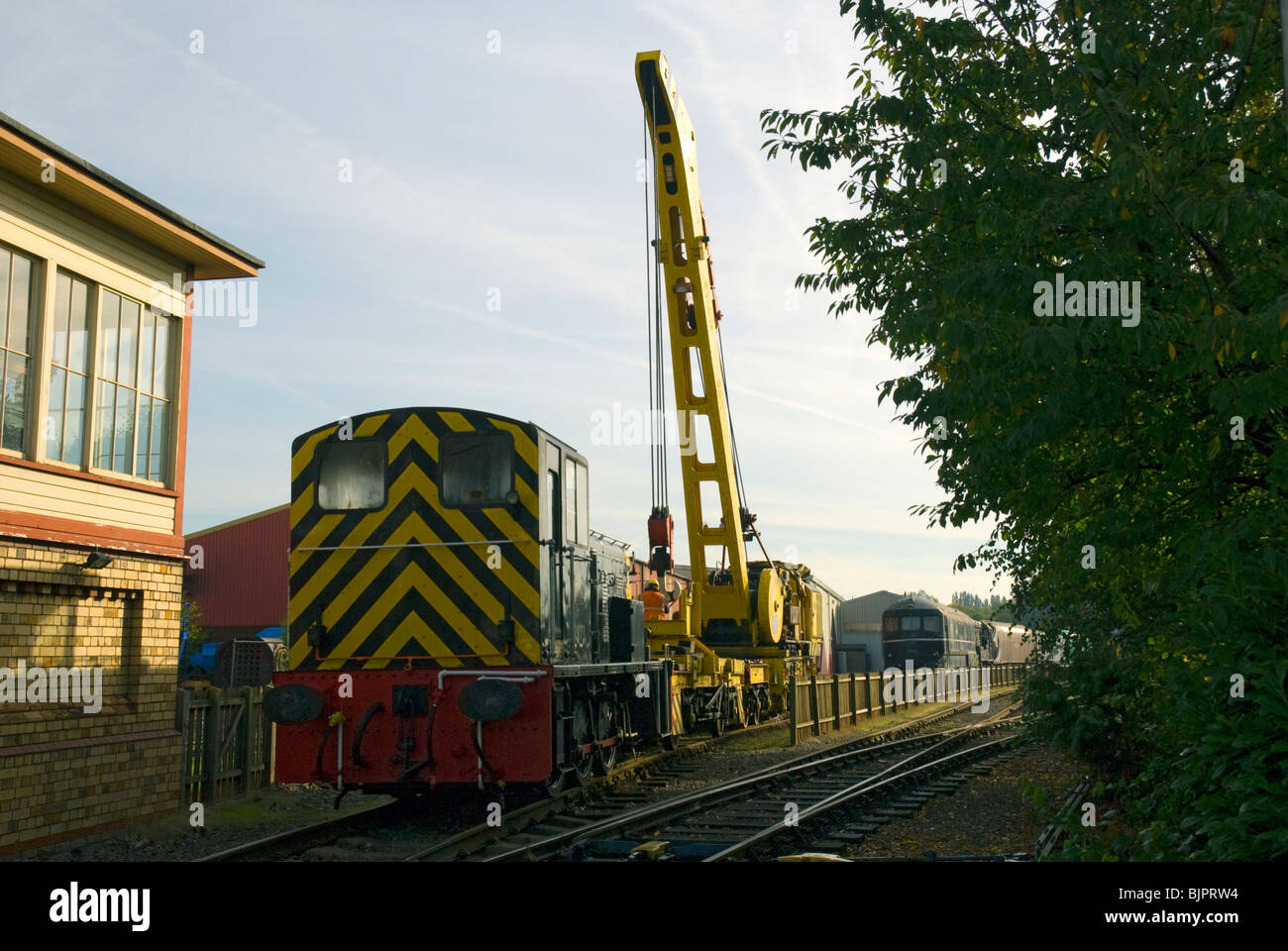 Shunting loco and Cowans Sheldon 50 tonne strut jib rail crane at Crewe, Cheshire, UK Stock Photo